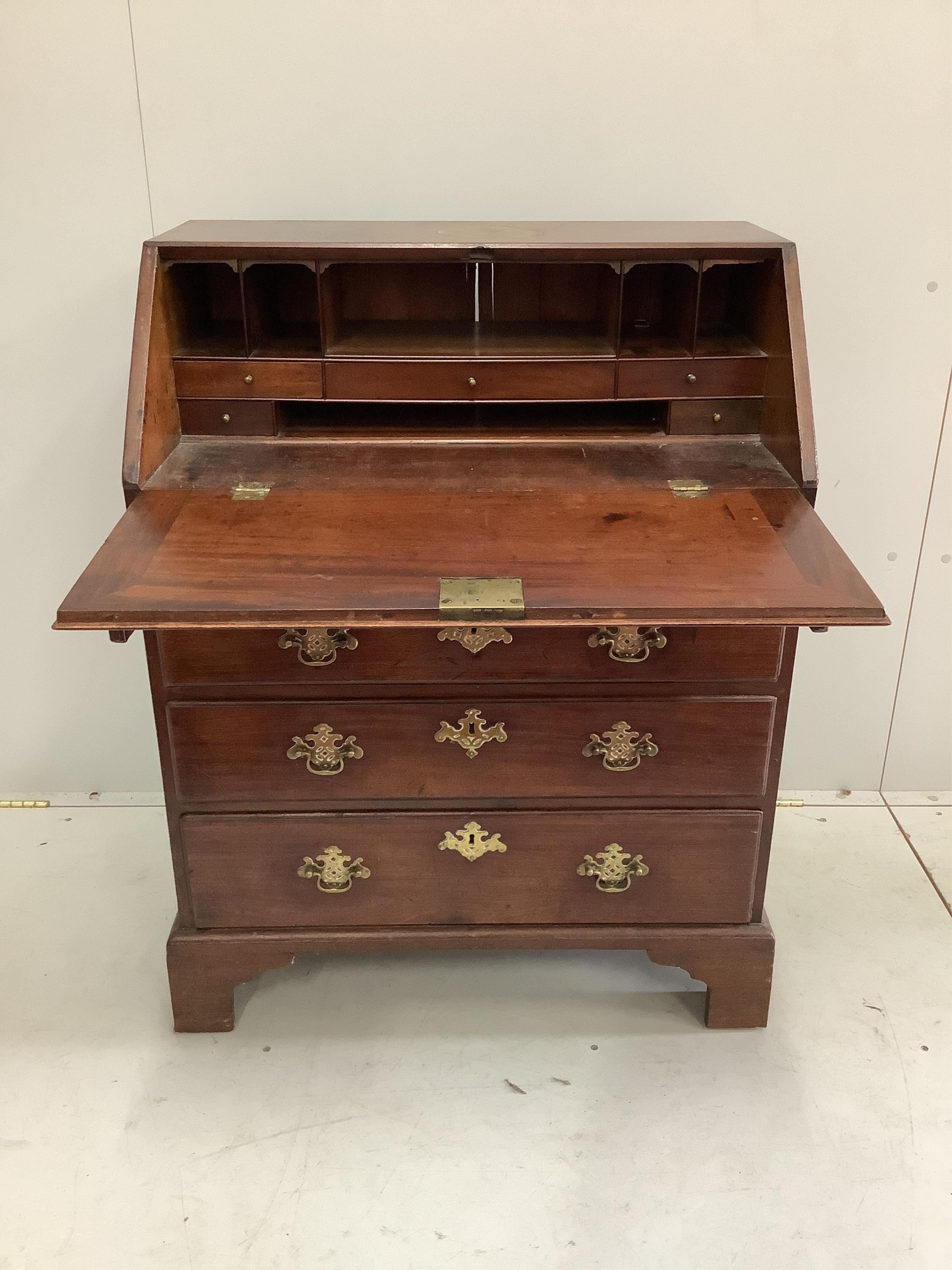 A small George III mahogany bureau, width 76cm, depth 46cm, height 100cm. Condition - fair